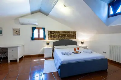 Letto o letti in una camera di La Bouganville WI-FI Cagliari centro storico
