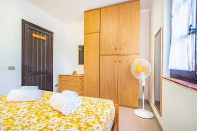 Letto o letti in una camera di Perla Marina, Estate Infinita, Is Mortorius