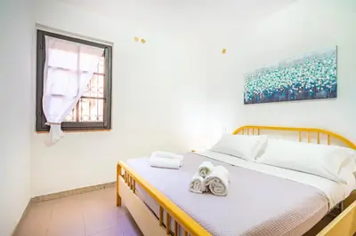 Letto o letti in una camera di Perla Marina, Estate Infinita, Is Mortorius