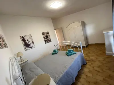 Letto o letti in una camera di Casa Vacanze Fior di Mondo