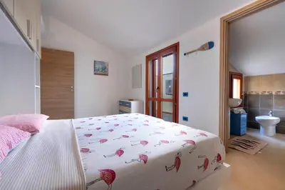 Letto o letti in una camera di Casa dei Giganti