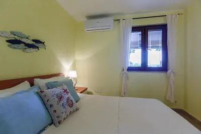 Letto o letti in una camera di Splendid View Porto Pino Hill