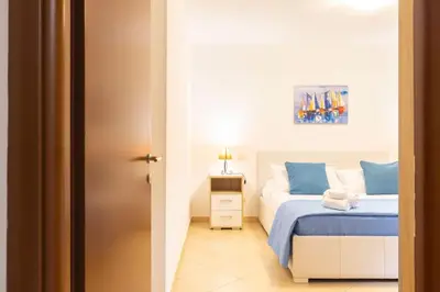 Letto o letti in una camera di Cala Sinzias Jo Beach