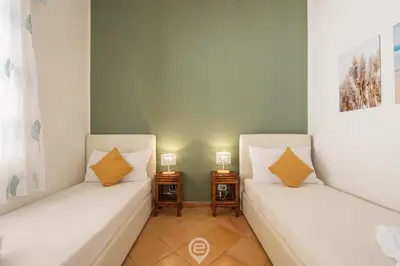 Letto o letti in una camera di Villa Erika