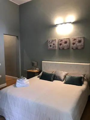 Letto o letti in una camera di Nuovo, tranquilla e in città
