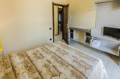 Letto o letti in una camera di B&B nel cuore di Loceri
