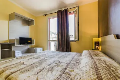 Letto o letti in una camera di B&B nel cuore di Loceri