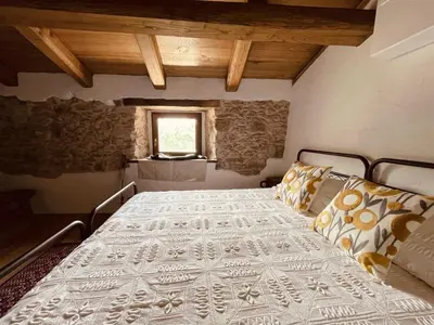 Letto o letti in una camera di Casa Asproni