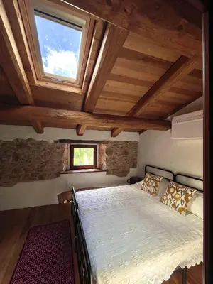 Letto o letti in una camera di Casa Asproni