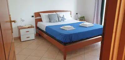 Letto o letti in una camera di Alessia