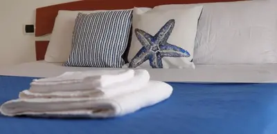 Letto o letti in una camera di Alessia