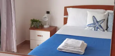 Letto o letti in una camera di Alessia