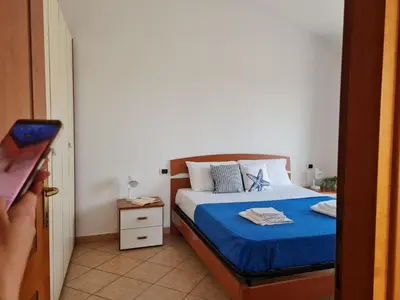 Letto o letti in una camera di Alessia