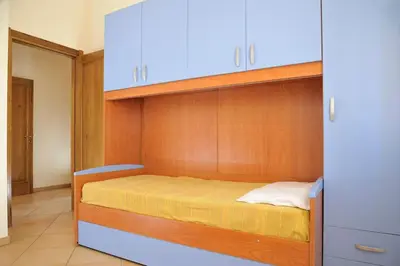 Letto o letti in una camera di I Pini - appartamento mare Sardegna