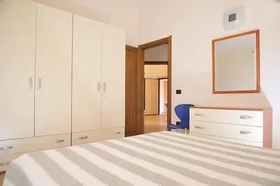 Letto o letti in una camera di I Pini - appartamento mare Sardegna