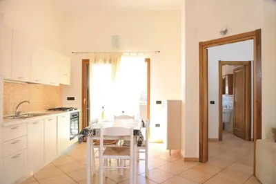 Cucina o angolo cottura di I Pini - appartamento mare Sardegna