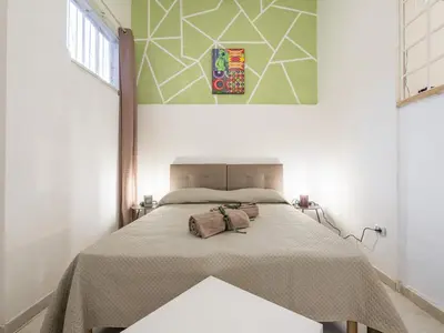 Letto o letti in una camera di Civico 35 Cozy Loft Cagliari