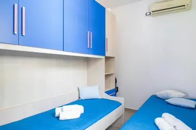 Letto o letti in una camera di Casa Paola