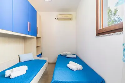 Letto o letti in una camera di Casa Paola
