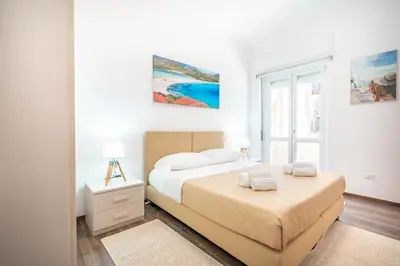 Letto o letti in una camera di Terrazza Garibaldi, Centro storico