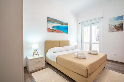 Letto o letti in una camera di Terrazza Garibaldi, Centro storico