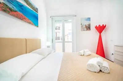 Letto o letti in una camera di Terrazza Garibaldi, Centro storico