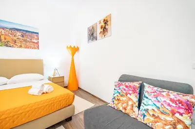 Letto o letti in una camera di Terrazza Garibaldi, Centro storico