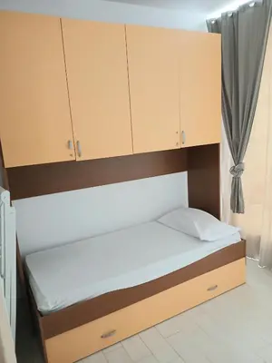 Letto o letti in una camera di Casa Vacanze condominio I Giardini, Pula