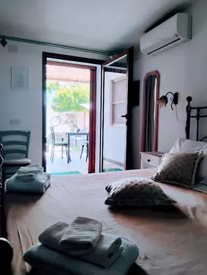 Letto o letti in una camera di La casa del glicine Marrubiu