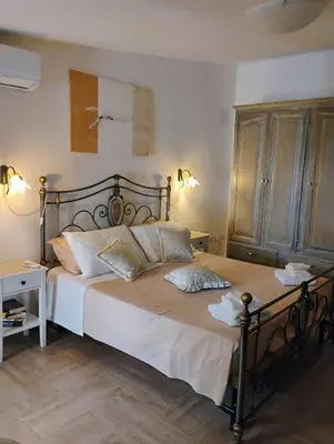 Letto o letti in una camera di La casa del glicine Marrubiu