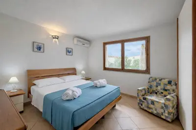 Letto o letti in una camera di Domus Mirta