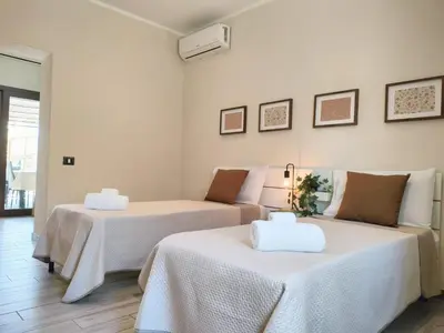 Letto o letti in una camera di Casa Laurina