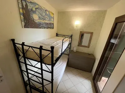 Letto o letti in una camera di Villetta Laura By La Via Del Mare Viaggi e Vacanze