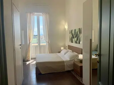 Letto o letti in una camera di Onlyrooms V - Sea View & Train Station