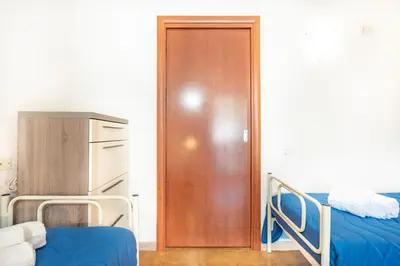 Letto o letti in una camera di Villetta degli Oleandri - Geremeas 2