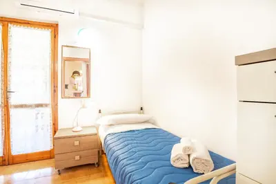 Letto o letti in una camera di Villetta degli Oleandri - Geremeas 2