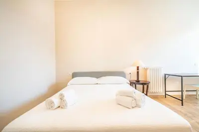 Letto o letti in una camera di Novecento, Appartamento di Design