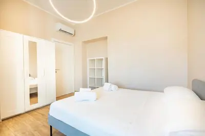 Letto o letti in una camera di Novecento, Appartamento di Design