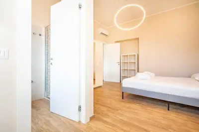 Letto o letti in una camera di Novecento, Appartamento di Design
