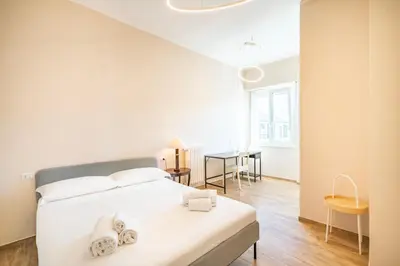 Letto o letti in una camera di Novecento, Appartamento di Design