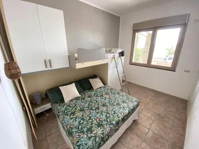 Letto o letti in una camera di Villa Amea
