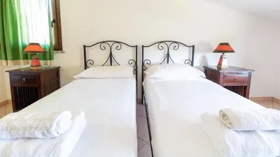 Letto o letti in una camera di Casa Via Leopardi 124