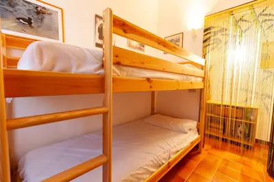 Letto o letti in una camera di Villa Acquario