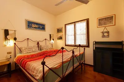 Letto o letti in una camera di Villa Acquario