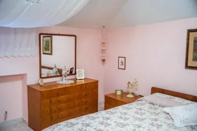 Letto o letti in una camera di casa Archiottu