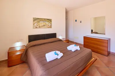 Letto o letti in una camera di Casa Pisano