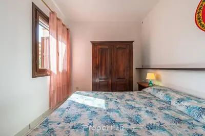 Letto o letti in una camera di Casa degli Oleandri by Propertize