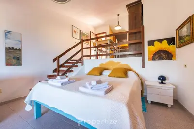 Letto o letti in una camera di Il terrazzo sulla duna 2 by Propertize - Torre dei Corsari