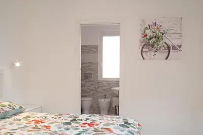 Letto o letti in una camera di In centro appartamento di charme con terrazza!