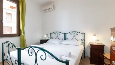Letto o letti in una camera di Vintage Home Cabras